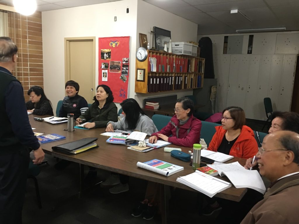 Adults learning together in a Salvation Army New Life Church ESL class